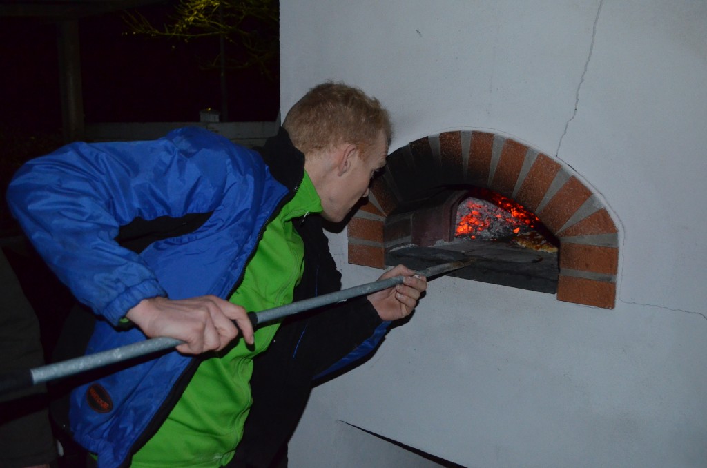 A Danish baking a pizza