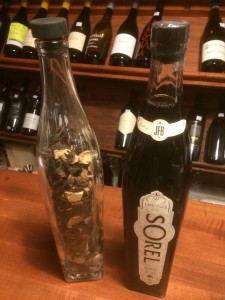 A bottle of Sorel next to a bottle of its botanicals