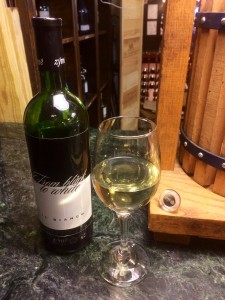 A glass of Zýmē "From black to white," a blend of White Rondinella, Gold Traminer, Kerner, and Incrocio Manzoni