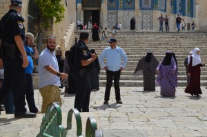 Muslim protestors chanting at Jewish men under the protection of an armed escort; Temple Mount, Old City, Jerusalem, Israel