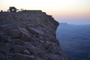 View of Makhtesh Ramon from the crater's edge, with ibex silhouetted against the sunrise; Mitzpe Ramon, Israel